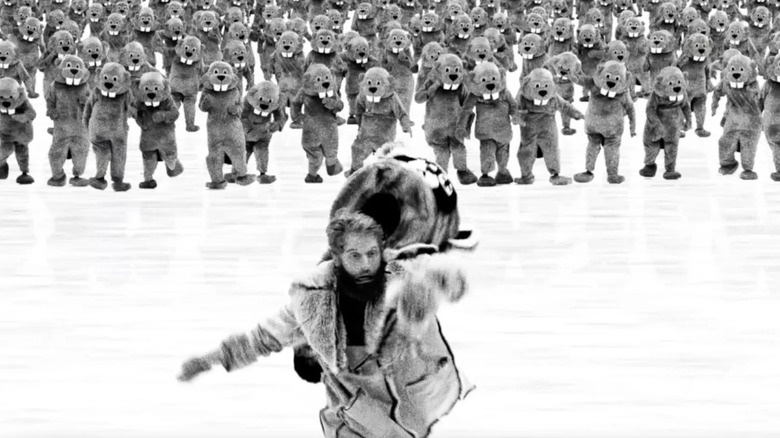 Ryland Brickson Cole Tews as Jean, being chased by beavers in Hundreds of Beavers
