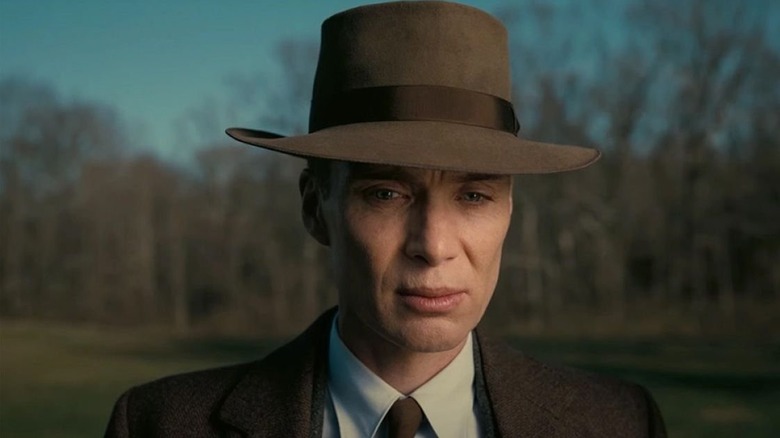 Cillian Murphy as Oppenheimer, brooding in Oppenheimer