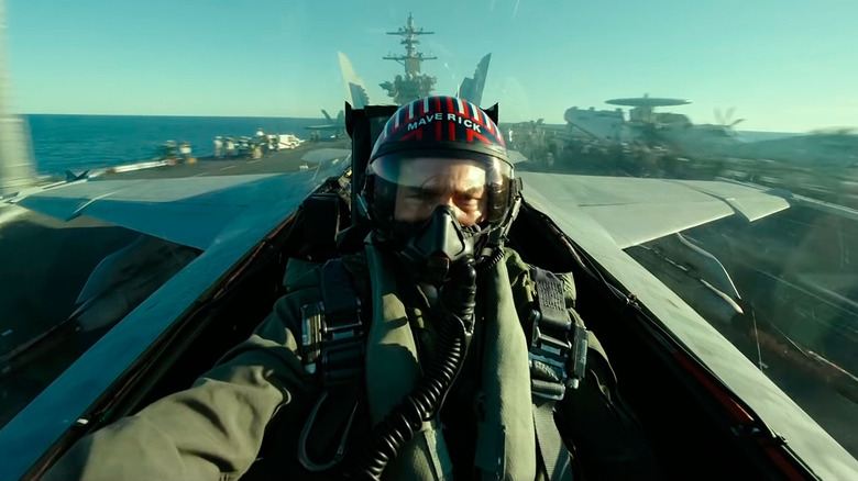 Tom Cruise as Maverick, flying a jet in Top Gun Maverick