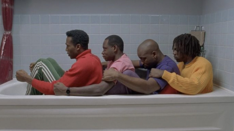 Leon Robinson as Derice Bannock, Rawle D. Lewis as Junior Bevi, Malik Yoba as Yul Brenner, and  Doug E. Doug as Sanka Coffiepracticing bobsled in the bathtub in Cool Runnings