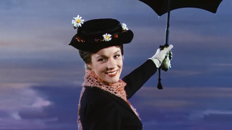 Julie Andrews as Mary Poppins flying with her umbrella in Mary Poppins