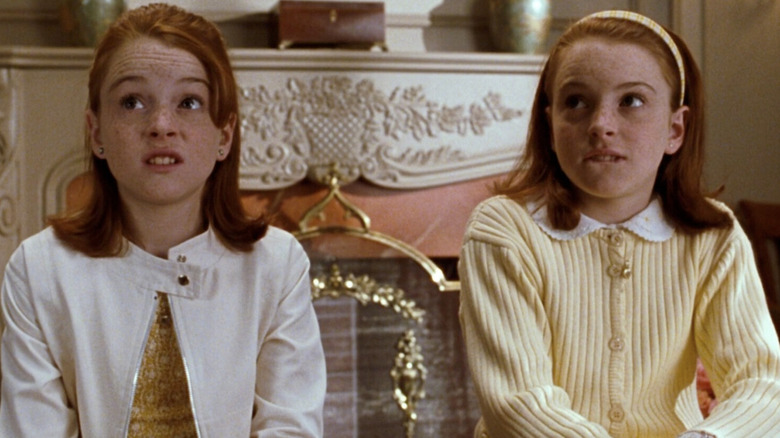 Lindsay Lohan as Annie James and Hallie Parker looking guilty while talking to their mother in The Parent Trap