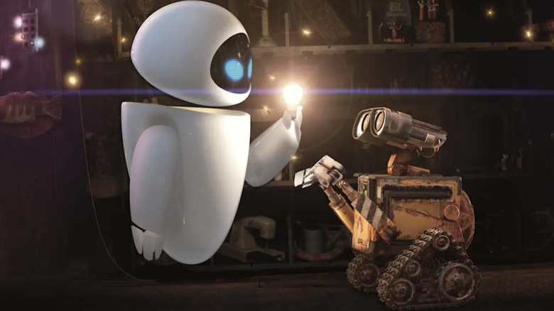 Eve and Wall-E looking at a lightbulb in Wall-E