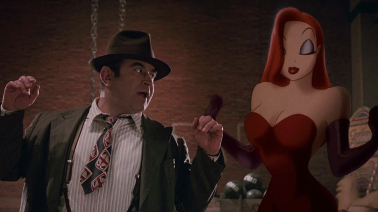 Bob Hoskins as Eddie Valiant with Jessica Rabbit in Judge Doom's liar in Who Framed Roger Rabbit