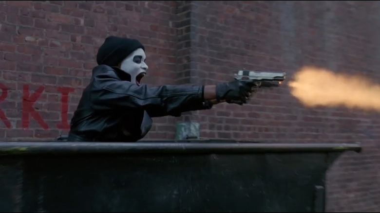 Anthony Curtis (Larenz Tate) wears makeup and fires his gun in Dead Presidents