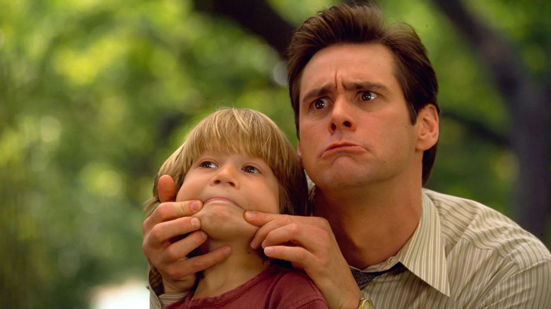 Max (Justin Cooper) and Fletcher Reede (Jim Carrey) make silly faces in Liar Liar
