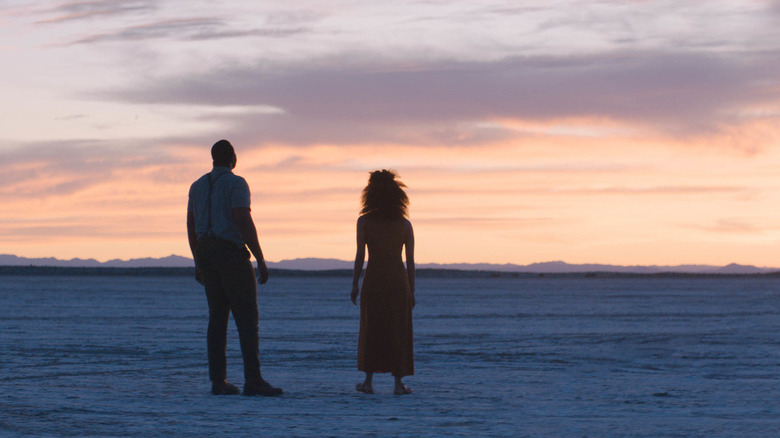 Will (Winston Duke) and Emma (Zazie Beetz) look into the wilderness in Nine Days