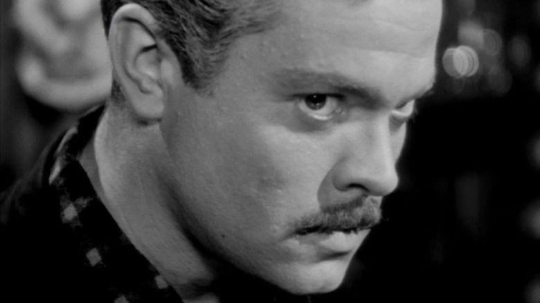 Franz Kindler/Professor Charles Rankin (Orson Welles) looks suspicious in The Stranger