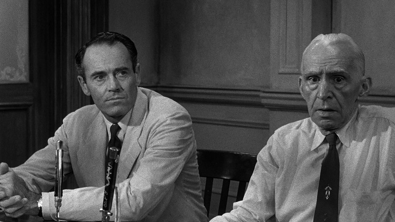 Henry Fonda as Juror #8 and Joseph Sweeney as Juror #9, sitting next to each other in the middle of deliberation in 12 Angry Men.
