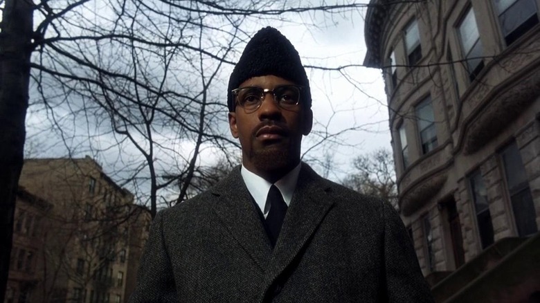 Denzel Washington as Malcolm X in Malcolm X, looking toward the middle distance behind the camera.