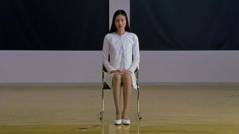 Asami (Eihi Shiina) in chair at audition in Audition