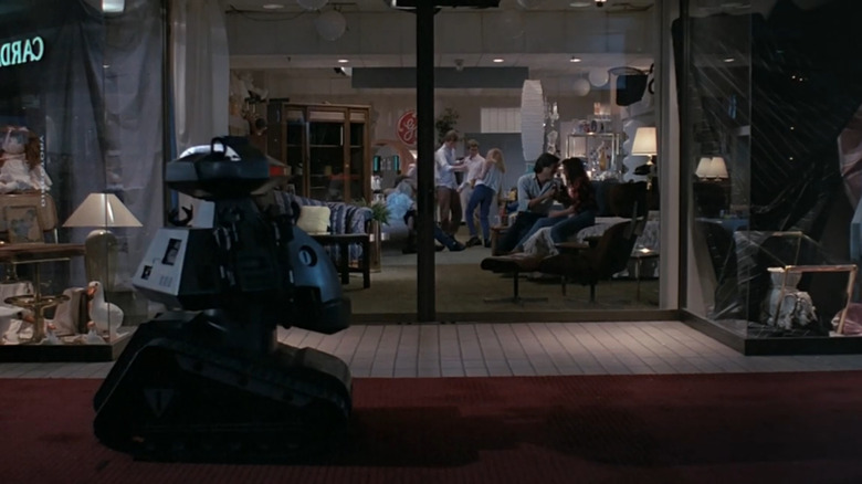 Killbot rolling by after-hours part in Chopping Mall