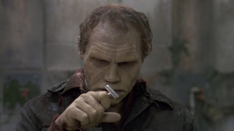 Bub (Sherman Howard) studying a razor in Day of the Dead