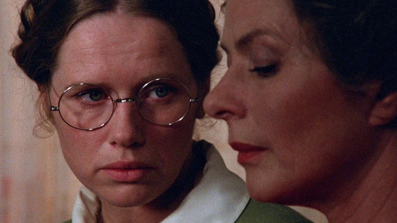 Liv Ullmann as Eva sitting next to and looking at Ingrid Bergman as Charlotte in Autumn Sonata
