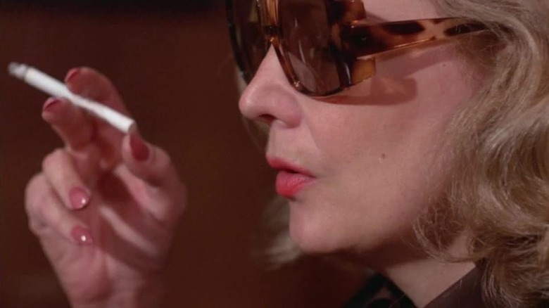 Close-up of Gena Rowlands as Myrtle with cigarette and sunglasses in Opening Night
