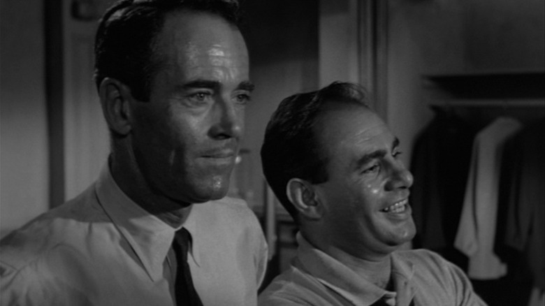Henry Fonda as Juror 8 and Martin Balsam as Juror 1 in a black and white shot from 12 Angry Men