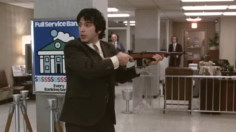 Al Pacino as Sonny pointing a gun in the lobby of the bank in Dog Day Afternoon