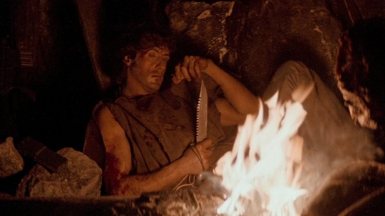 John Rambo (Sylvester Stallone) watches a fire in First Blood