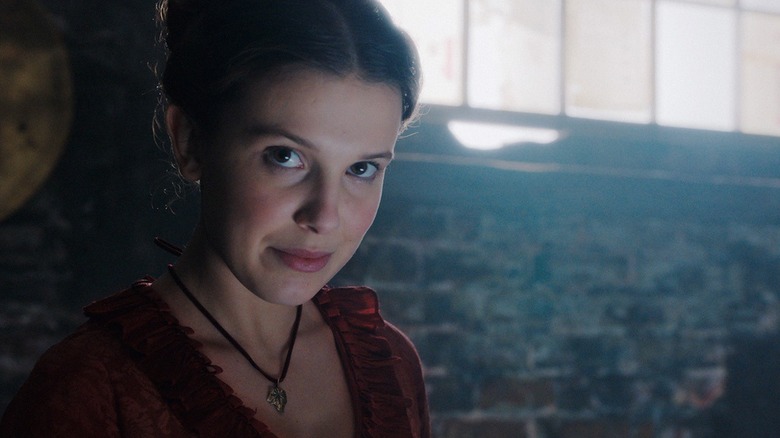 Millie Bobby Brown as Enola, getting an idea in Enola Holmes