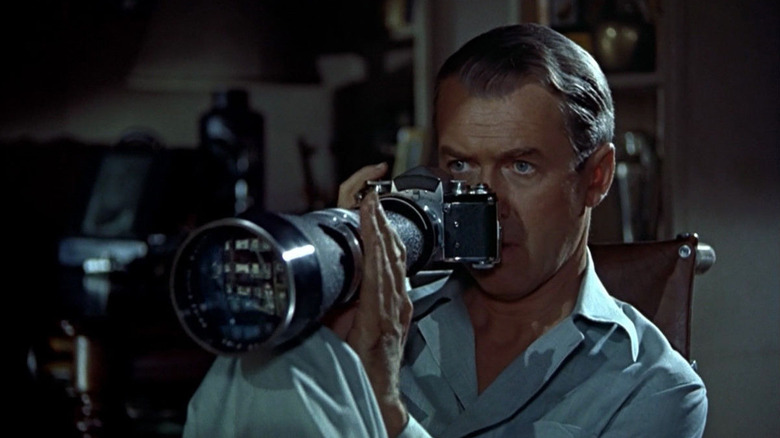 James Stewart as L.B., spying on his neighbors in Rear Window
