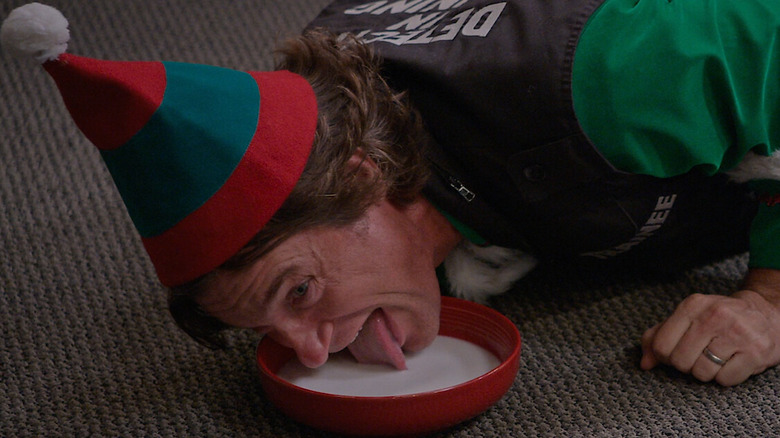 Jason Bateman as Jason, lapping up milk in Who Killed Santa?