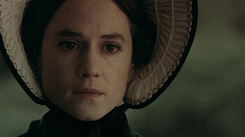 Holly Hunter as Ada McGrath wearing a bonnet and holding a stern expression in The Piano