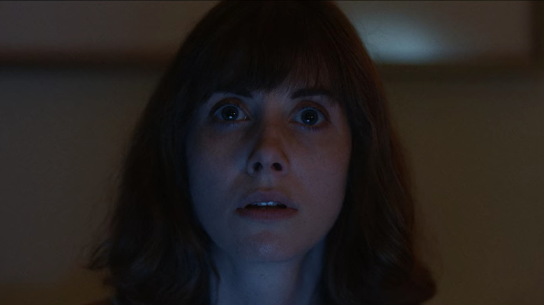 Sarah (Alison Brie) stares ahead in Horse Girl