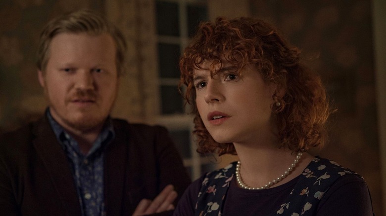 Jake (Jesse Plemons) and the young woman (Jessie Buckley) stare at something in I'm Thinking of Ending Things