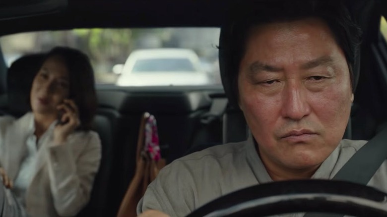 Kim Ki-taek (Song Kang-ho) drives Choi Yeon-gyo (Cho Yeo-jeong) in Parasite
