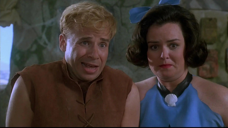 The Rubbles, played by Rick Moranis and Rosie O'Donnell, have a moment of skepticism in The Flintstones