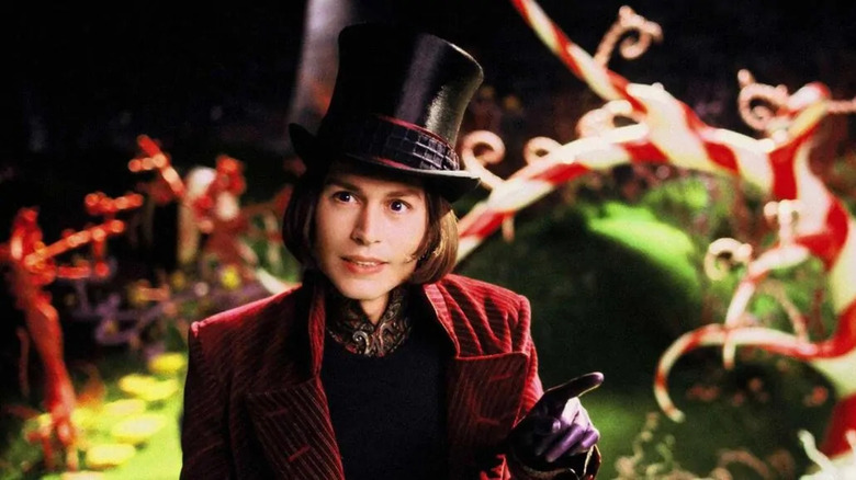Willy Wonka (Johnny Depp) stands in a garden of candy cane plants in Charlie and the Chocolate Factory