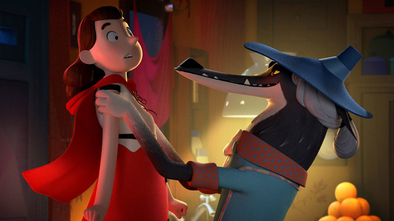 Rolf (Rob Brydon) holds up Little Red Riding Hood (Dolly Heavey) while disguised as her grandmother in Revolting Rhymes