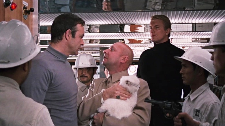 Blofeld (Donald Pleasence) and his men confront James Bond (Sean Connery) with guns drawn in You Only Live Twice