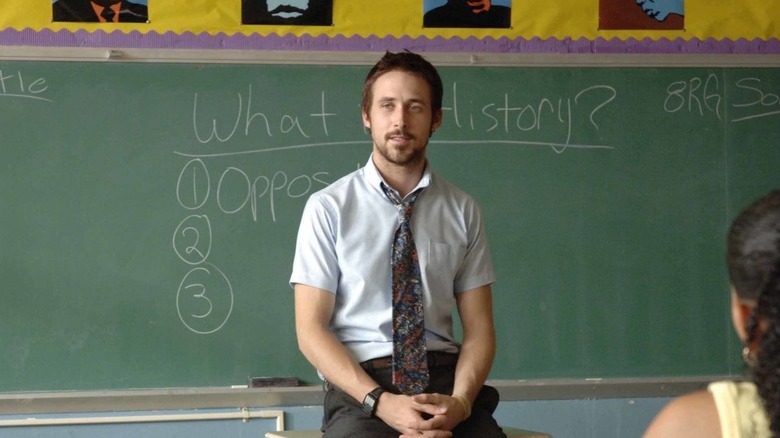 Ryan Gosling as Dan, sitting in front of a chalk board in Half Nelson