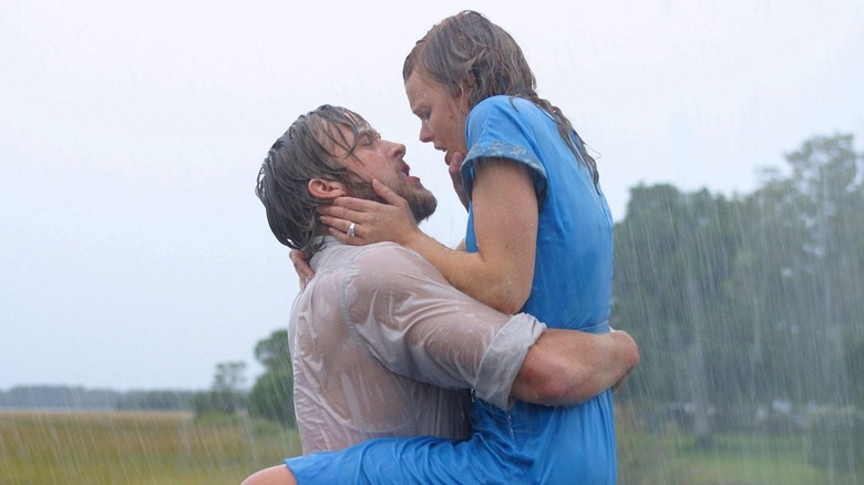 Ryan Gosling and Rachel McAdams as Noah and Allie, kissing in the rain in The Notebook