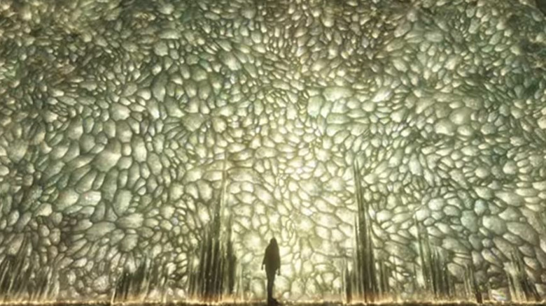 Sersi standing in from of a hive of stored memories