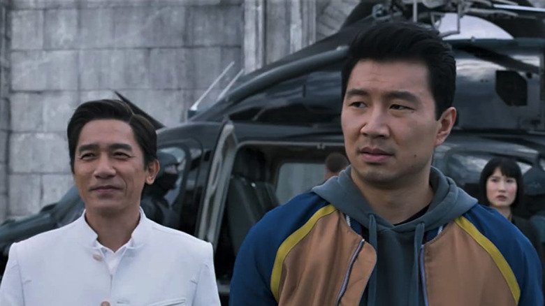 Wenwu and Shang-Chi walking away from a helicopter
