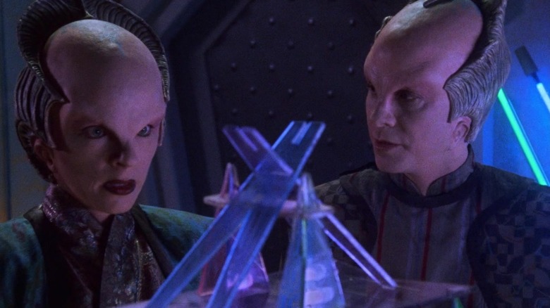 Delenn (Mira Furlan) and Lennier (Bill Mumy) regard a Minbari ritual artifact in Babylon 5