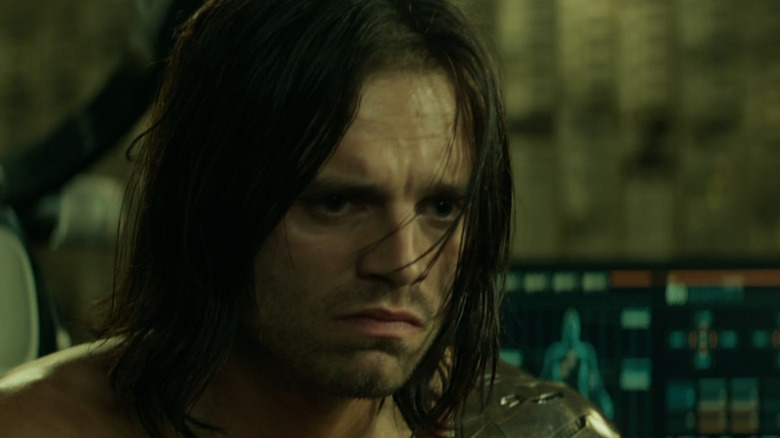 Bucky (Sebastian Stan) looking sad yet determined in Captain America: The Winter Soldier