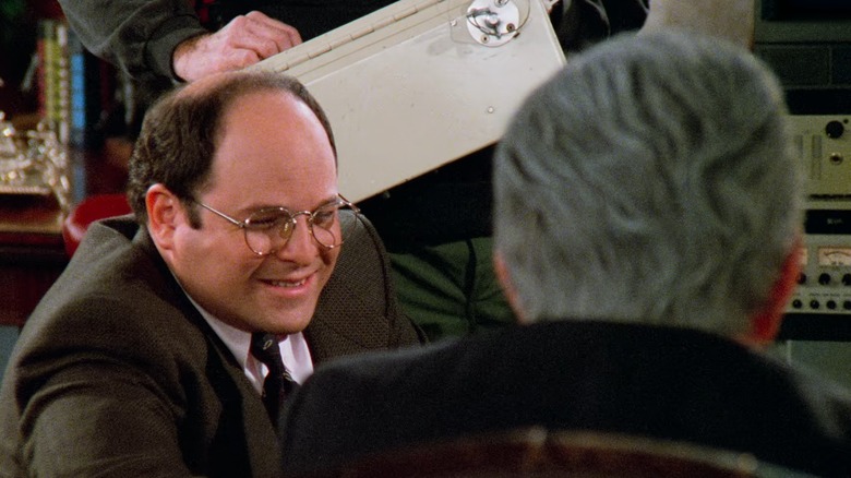 Jason Alexander as George Costanza laughs with LarryDavid/Lee Bear as George Steinbrenner on Seinfeld