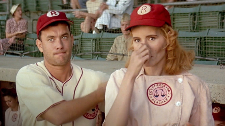 Geena Davis as Dottie and Tom Hanks as Jimmy giving batter signals in A League of Their Own