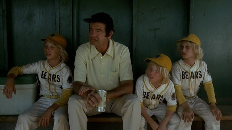 Walter Matthau as Morris, enjoying a beer with some Little Leaguers in The Bad News Bears