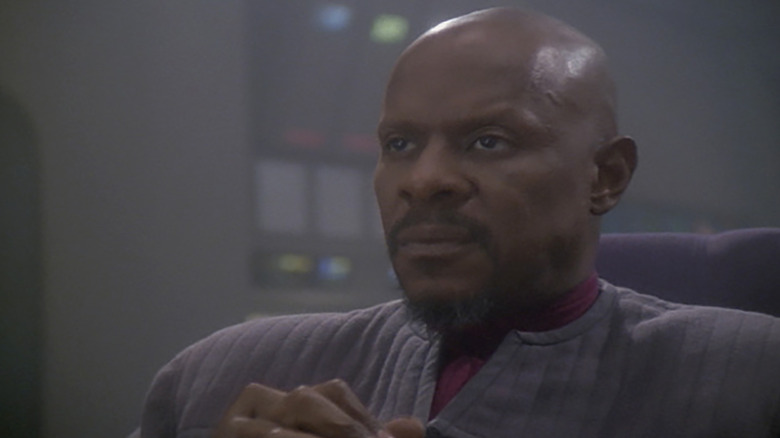 Stark Trek: Deep Space Nine's Sisko looking pensive