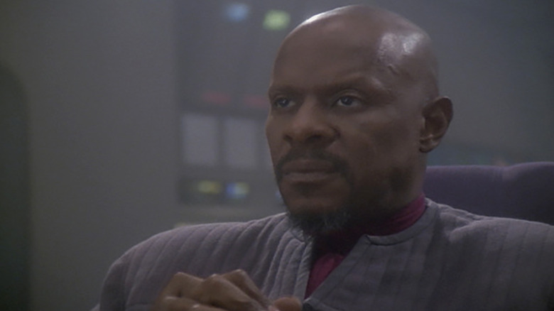 Stark Trek: Deep Space Nine's Sisko looking pensive