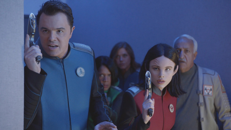 Captain Ed Mercer (Seth MacFarlane) with his phaser at the ready on The Orville