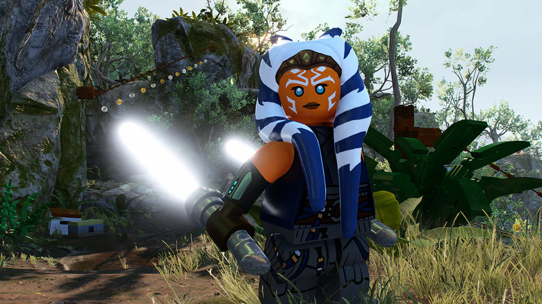 Ahsoka Tano stands with both of her lightsabers ignited in LEGO Star Wars: The Skywalker Saga
