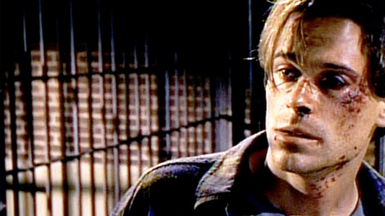 Nick Andros, played by Rob Lowe in the 1994 miniseries The Stand, is beaten and bruised within a prison cell