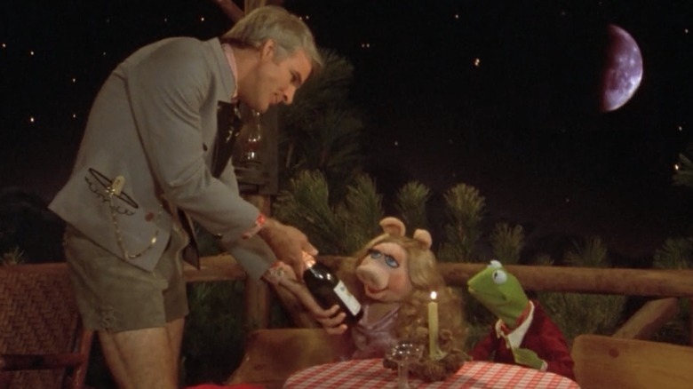 The Muppet Movie's Steve Martin serving Kermit and Miss Piggy