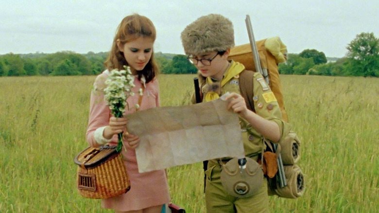 Sam Shakusky (Jared Gilman) and Suzy (Kara Hayward) read a map in Moonrise Kingdom