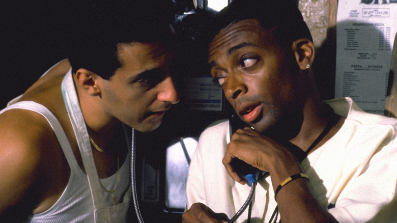 John Turturro as Pino and Spike Lee as Mookie talking in Do The Right Thing